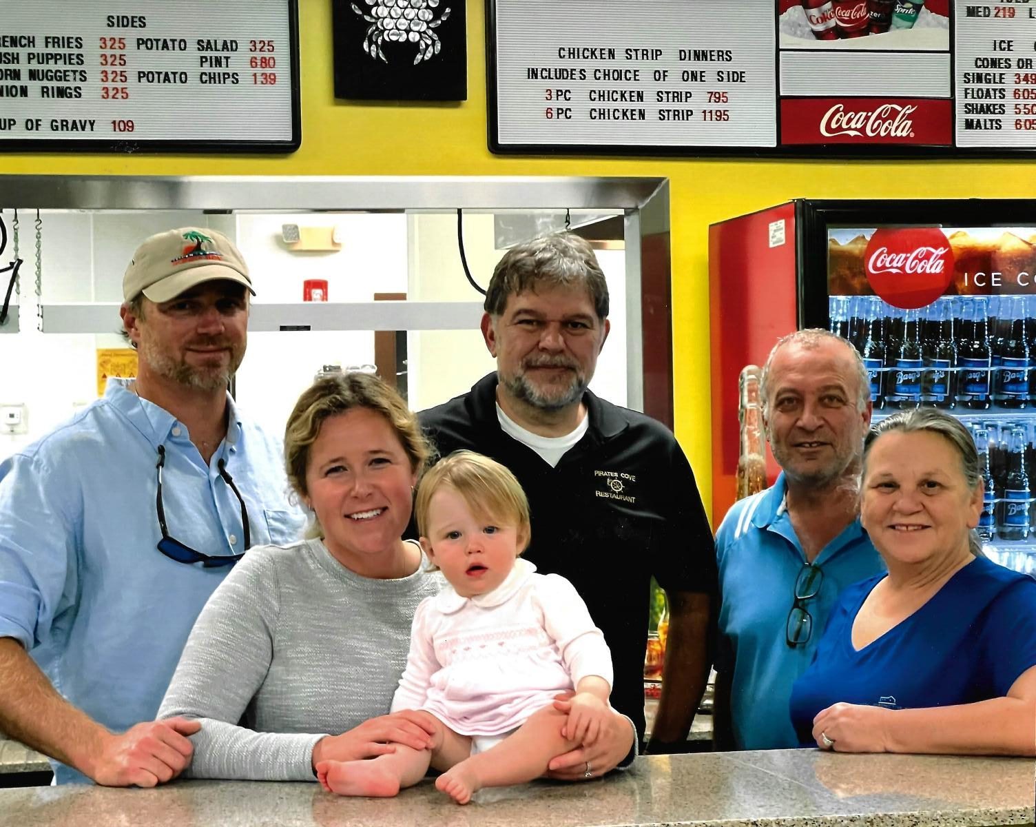 Family at the Pirate's Cove counter on Menge Avenue