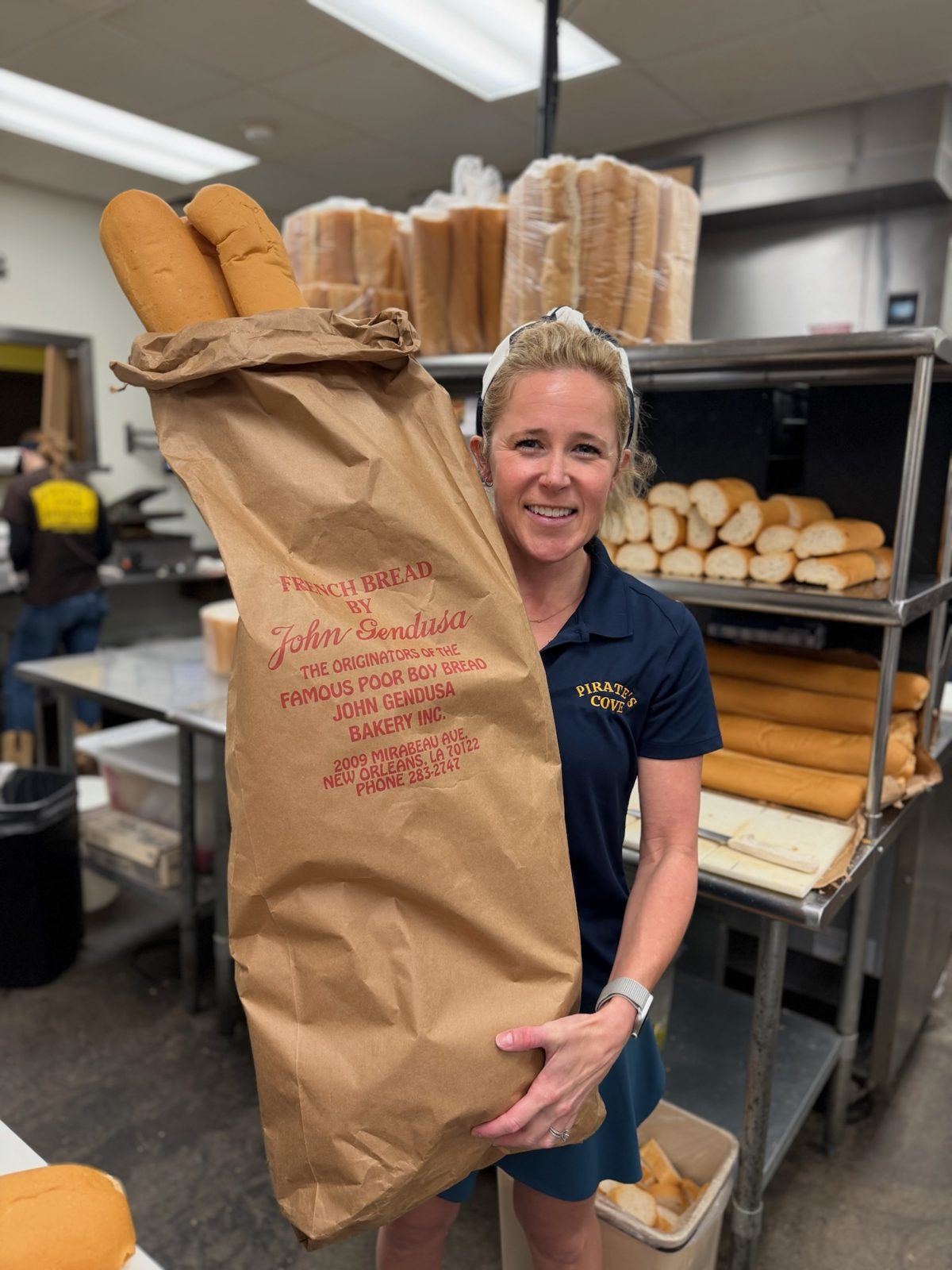 Mary Keith Rusbridge with a bag of John Gendusa po-boy bread