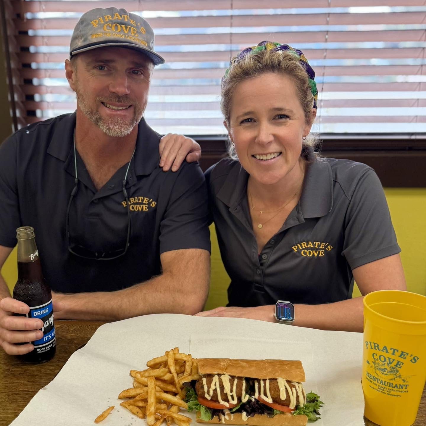 Patrick and Mary Keith Rusbridge at Pirate's Cove with a Po-Boy, fries, and Barq's